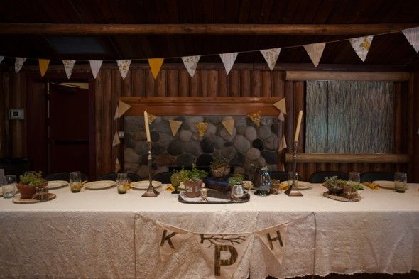 A rustic head wedding table at a lodge style wedding
