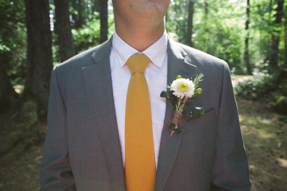 A yellow wedding tie at a rustic style wedding