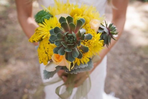 Bright yellow wedding bouquet at a woodsy rustic wedding