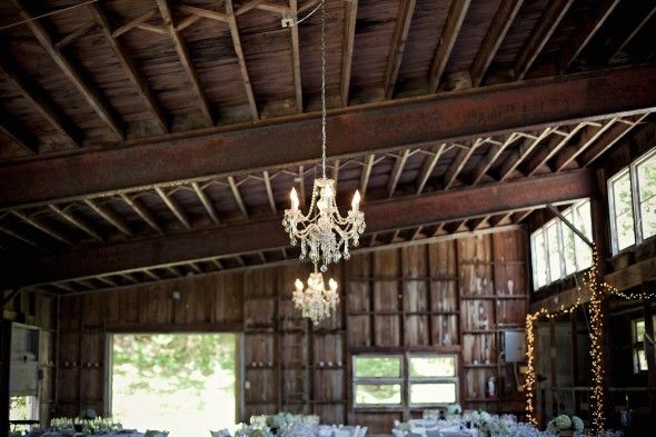 A barn with chandeliers at a barn wedding