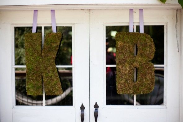 Large oversized moss letters hanging at a wedding