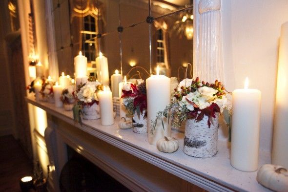 Birch vases and candles decorate a fall wedding 