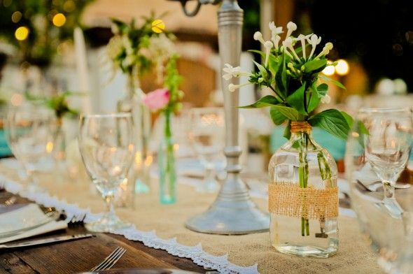 centerpieces using old bottles at a vintage wedding