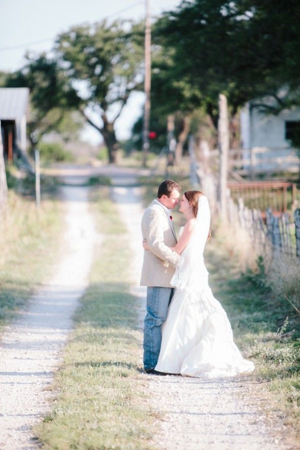 A bride and groom on a country road