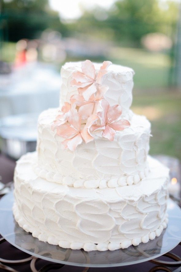 A white and pink wedding cake
