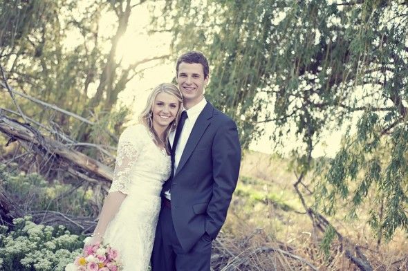  A bride and groom in the woods at their woodsy rustic wedding