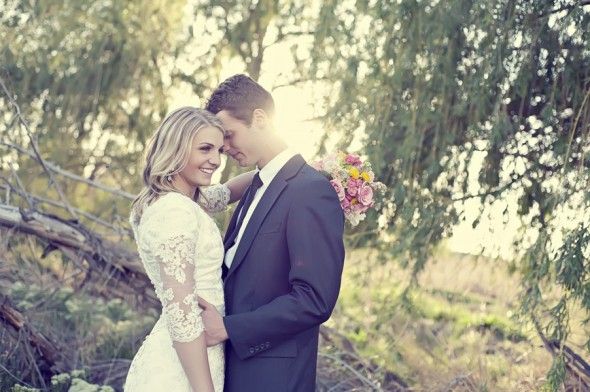 A rustic bride and groom in the woods