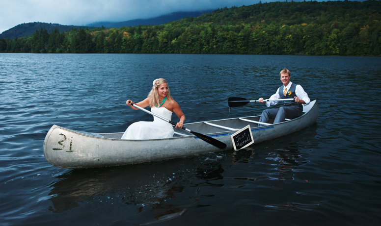 A bride and groom in a canoe