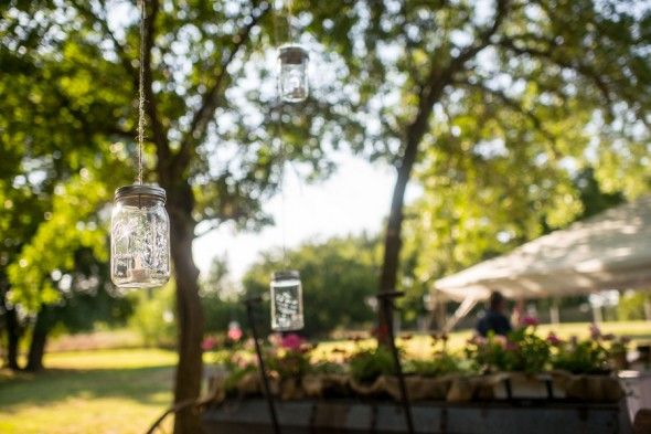 Hanging Lanterns at a Backyard Wedding