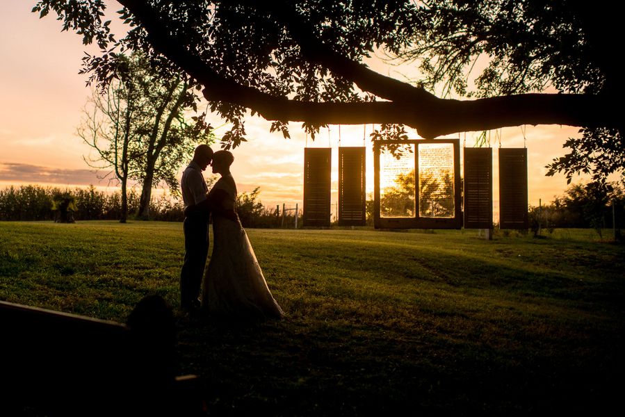 Bride and Groom as the Sun Sets on a Backyard Wedding