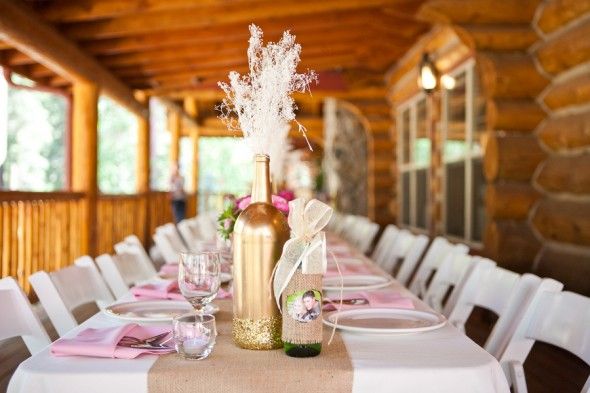 Gold Wine Bottles as Centerpieces at Rustic Wedding