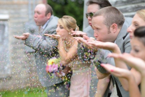 Wedding Party Tosses Candy Sprinkles on Bride + Groom