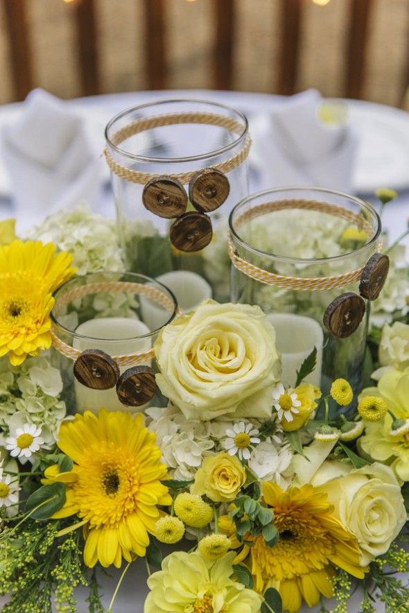 Rustic Wedding Centerpiece with Glass Hurricanes and Candles