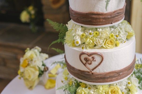 Wedding Cake with Flowers Between Tiers