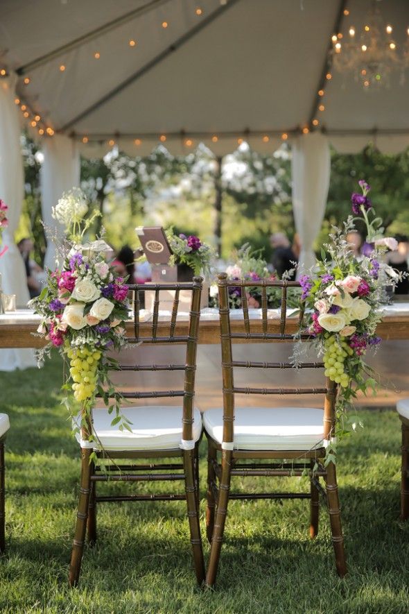 Flowers on the Bride and Grooms Chairs
