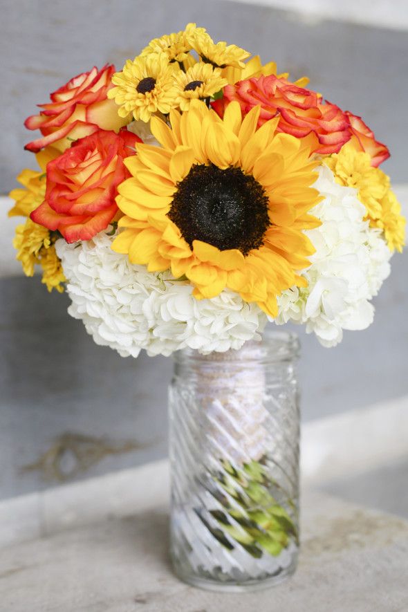A rustic wedding with a beautiful barn and a sunflower theme