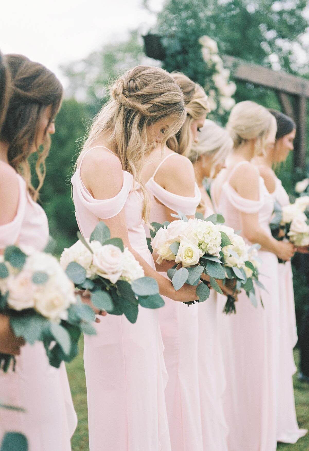 bridesmaids standing in pink dresses