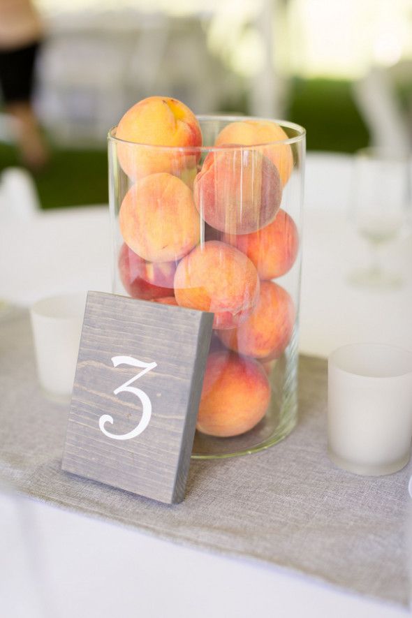 A great and easy DIY wedding centerpiece - see more from this stunning wedding.