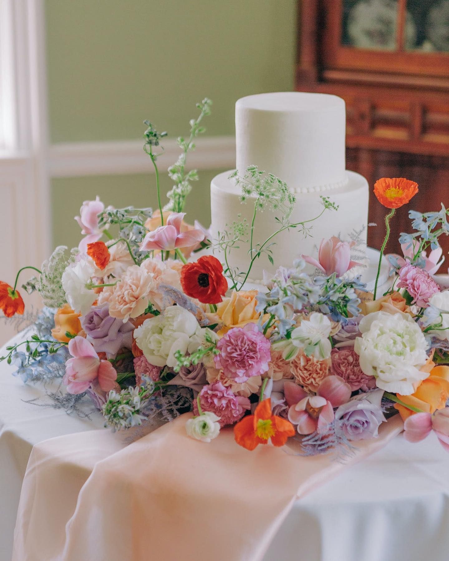 flowers surrounding wedding cake