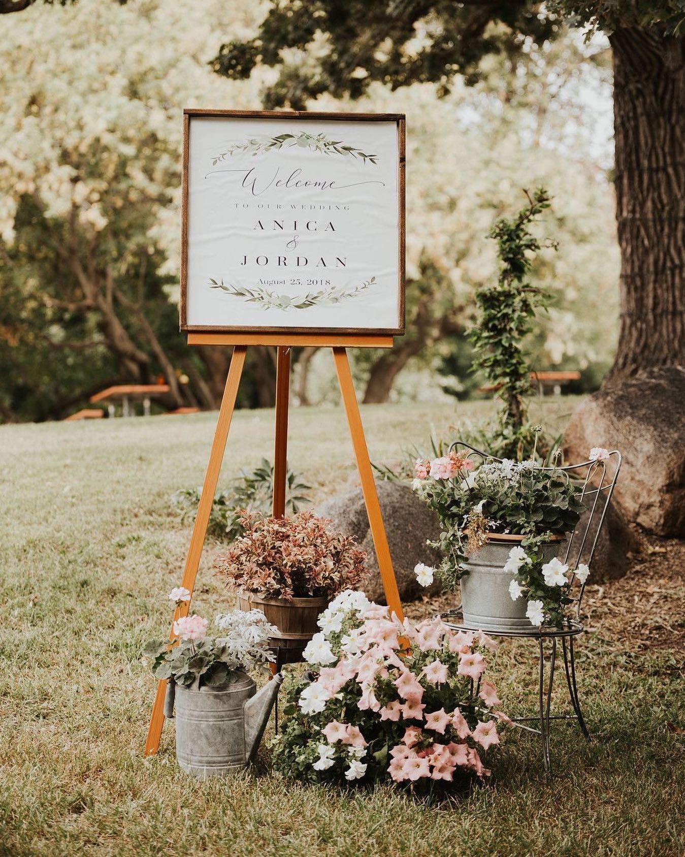 flower display around wedding sign