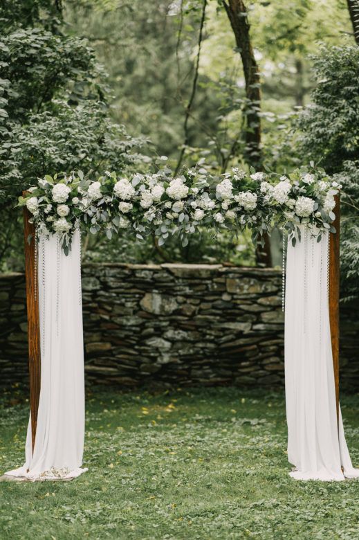 Floral and drapery wedding altar arch