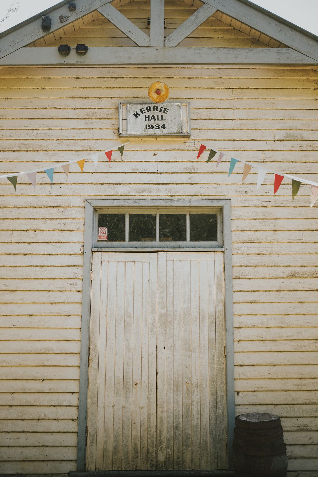 rustic wedding venue with colorful banner