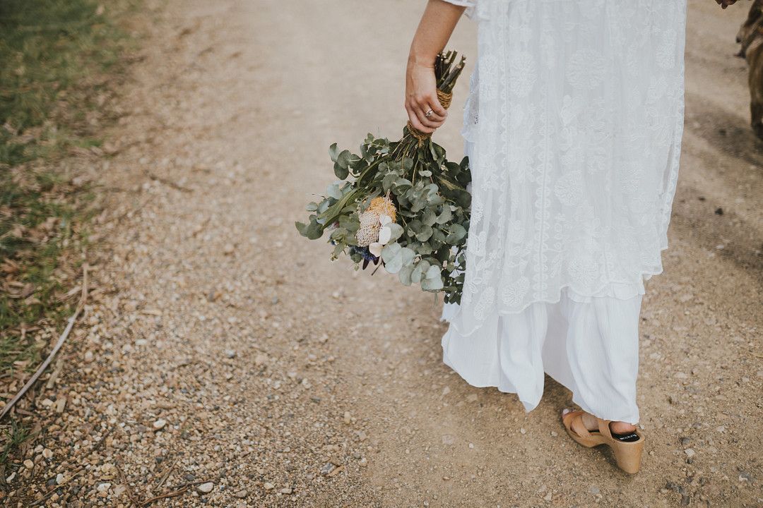 rustic bride carrying wedding bouquet