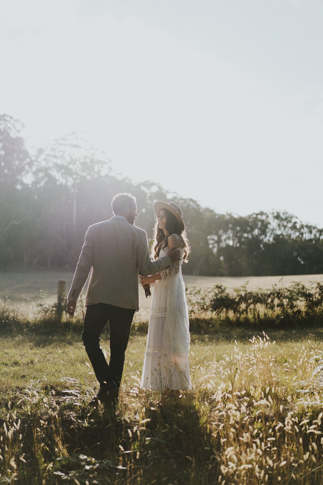 rustic country bride and groom in a meadow