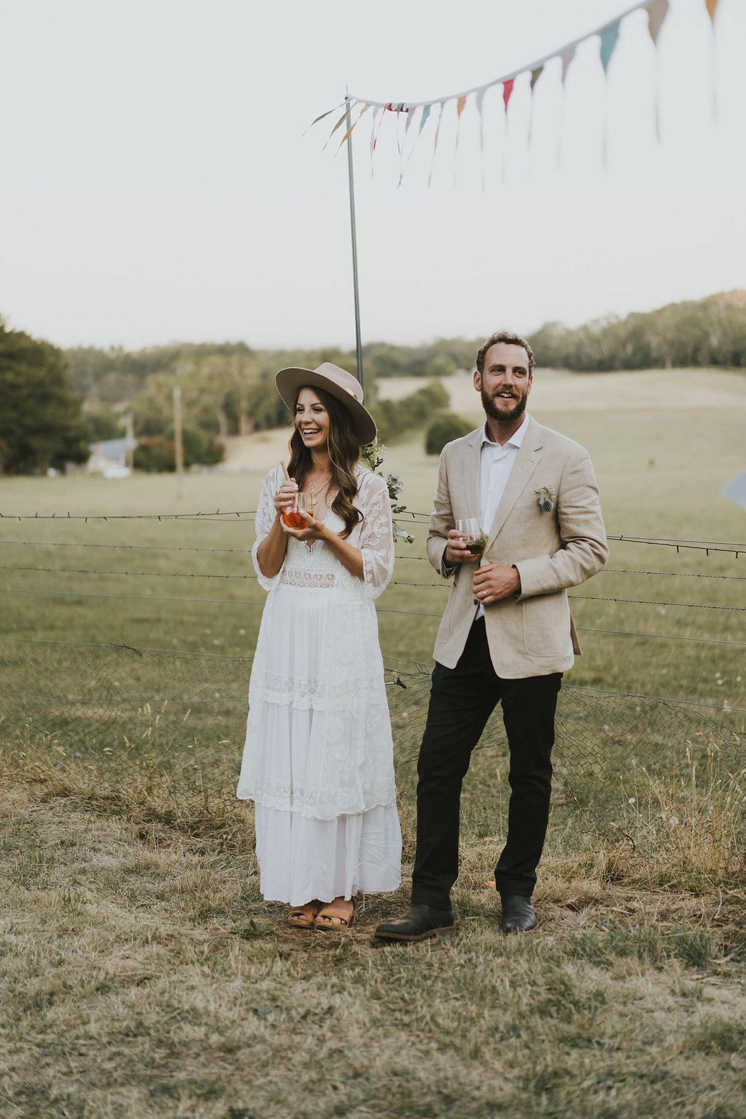 rustic bride and groom standing at reception