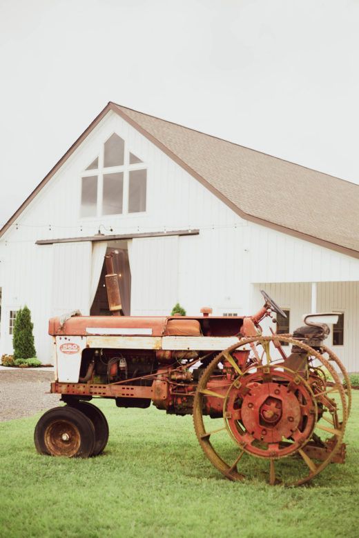 tractor in front of barn wedding venue