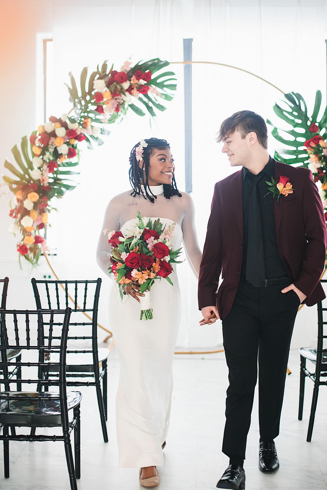 bride and groom walking down the aisle at bold and modern wedding inspiration shoot