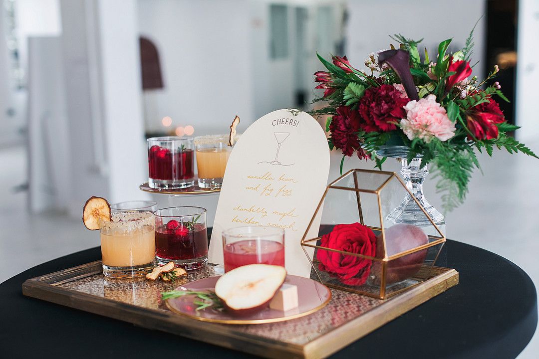 mini bar with drinks at bold and modern wedding