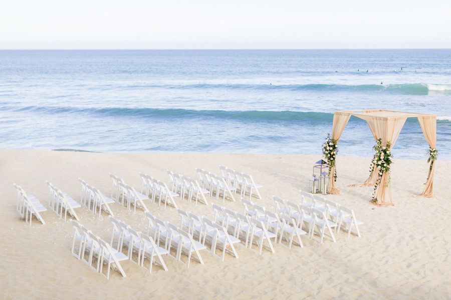 wedding chairs and altar on beach