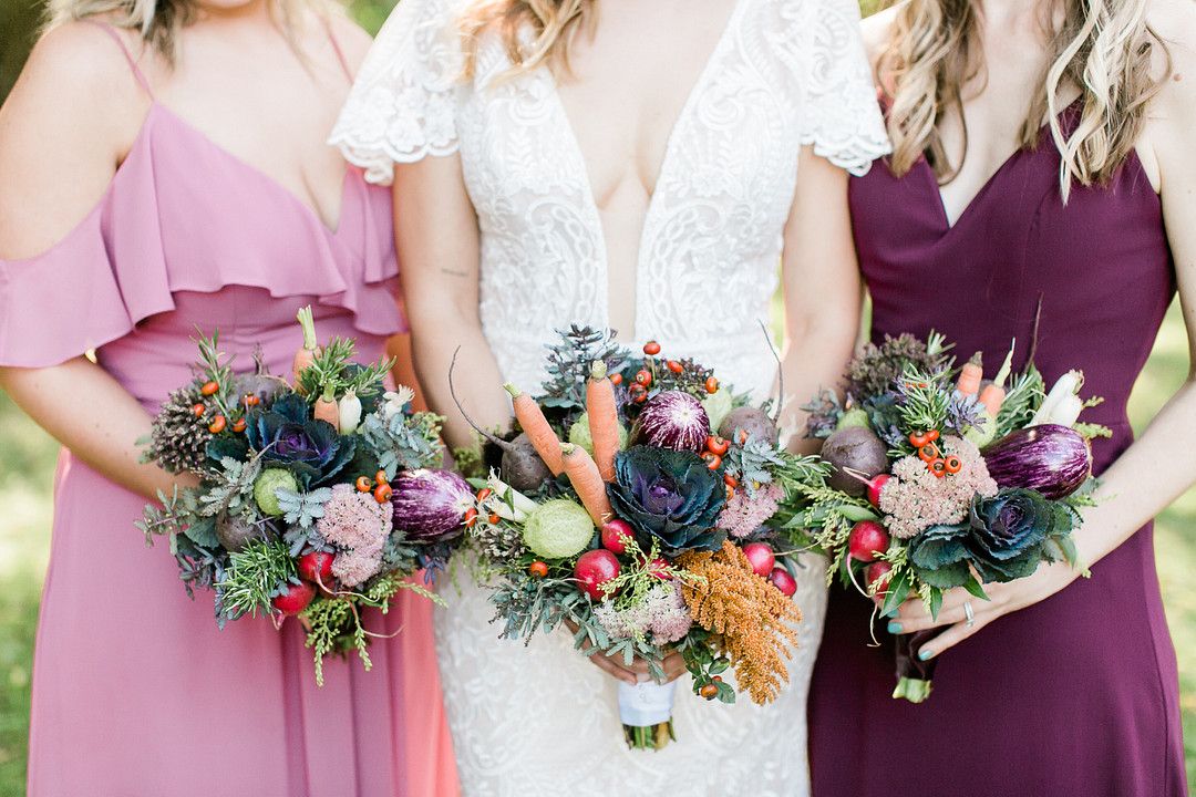 bride and bridesmaids holding bouquets made from vegetables