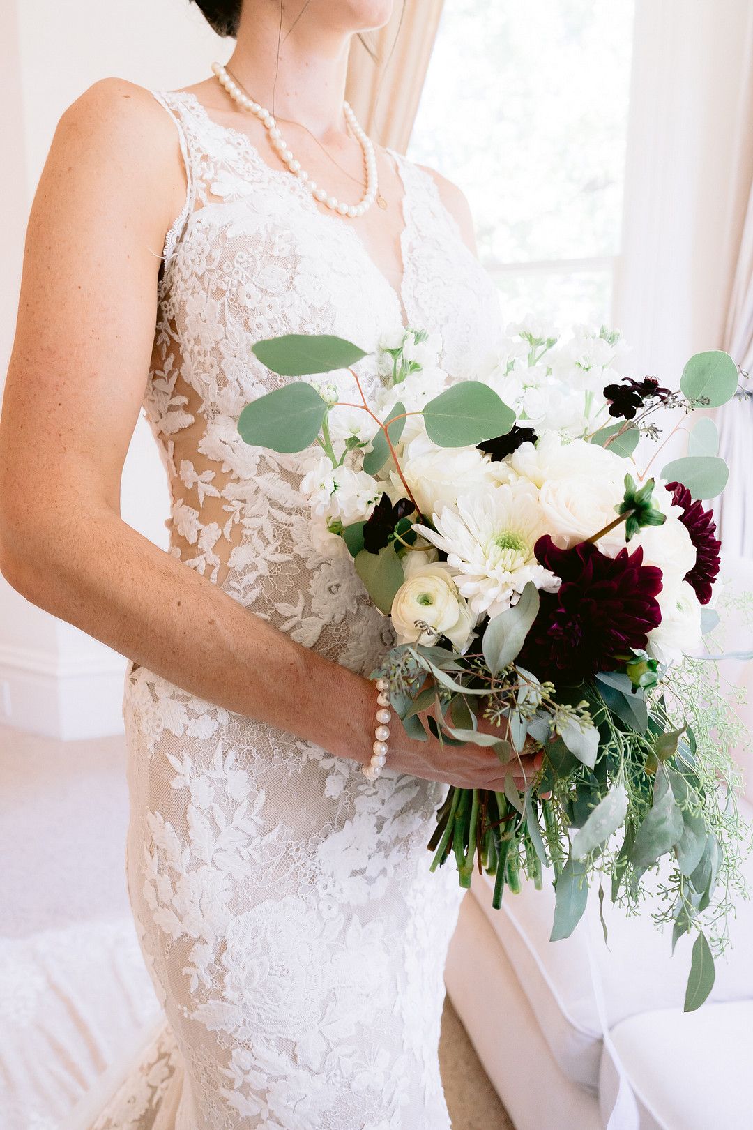 upclose picture of bride's flowers and dress