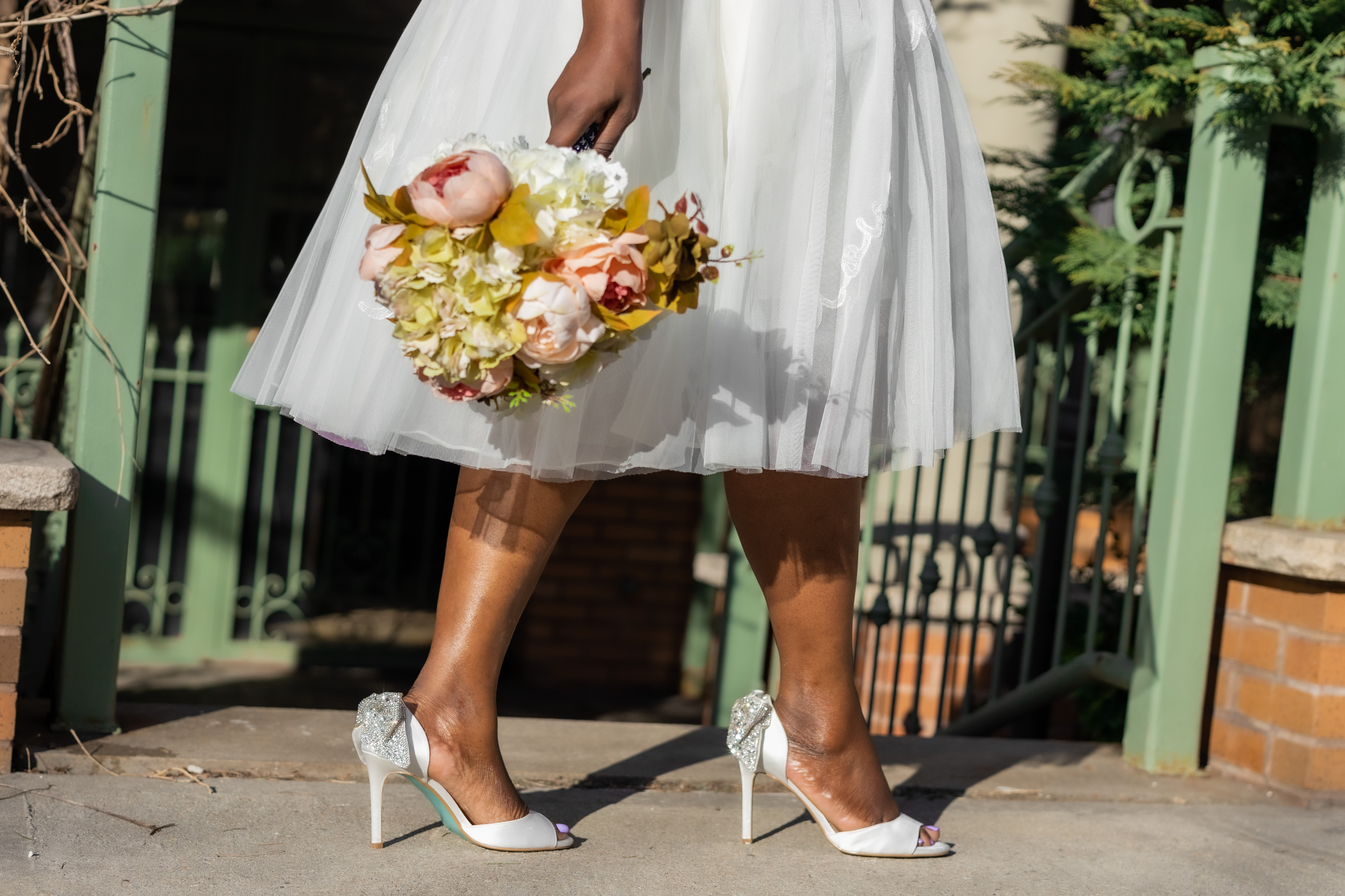 bride wearing sparkly wedding shoes