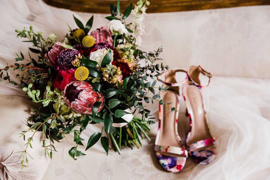 colorful petal themed wedding shoes and bouquet