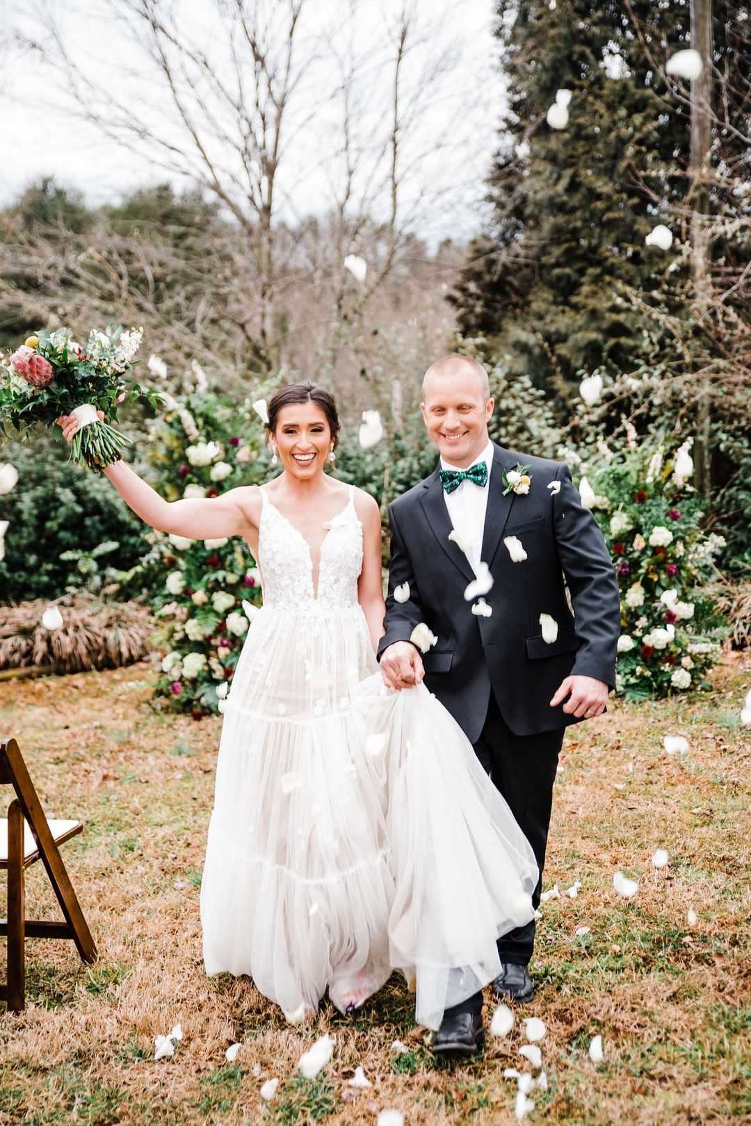 bride and groom at colorful petal themed wedding styled shoot