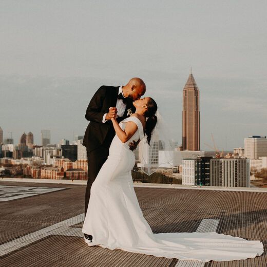 bride and groom dancing on rooftop