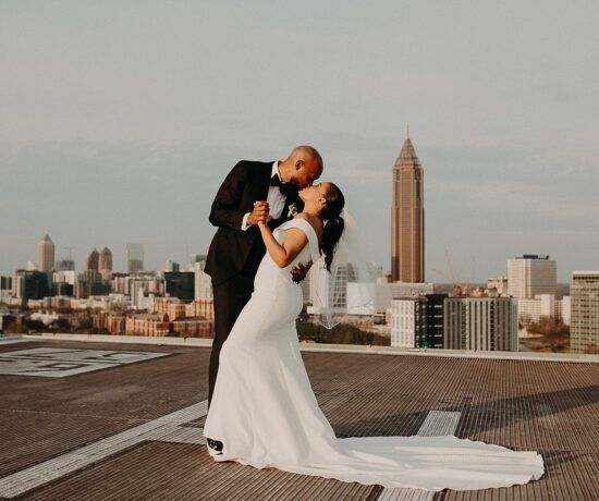 bride and groom dancing on rooftop