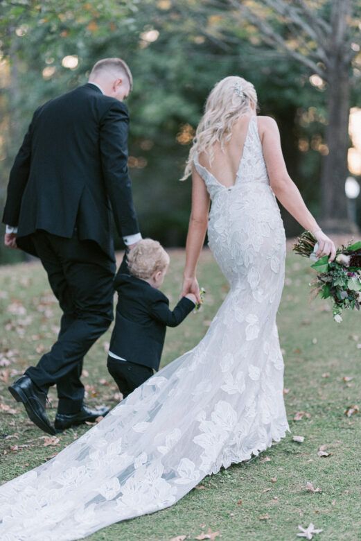 parents walking with son on wedding day