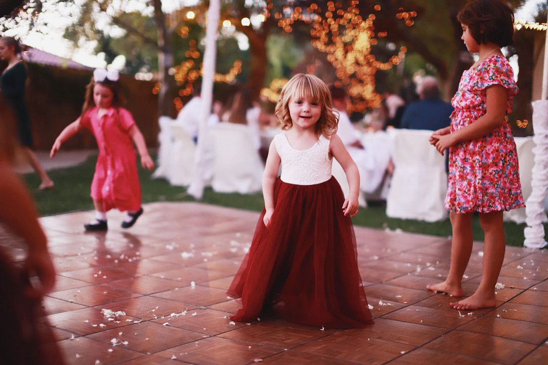 flower girl dancing at reception