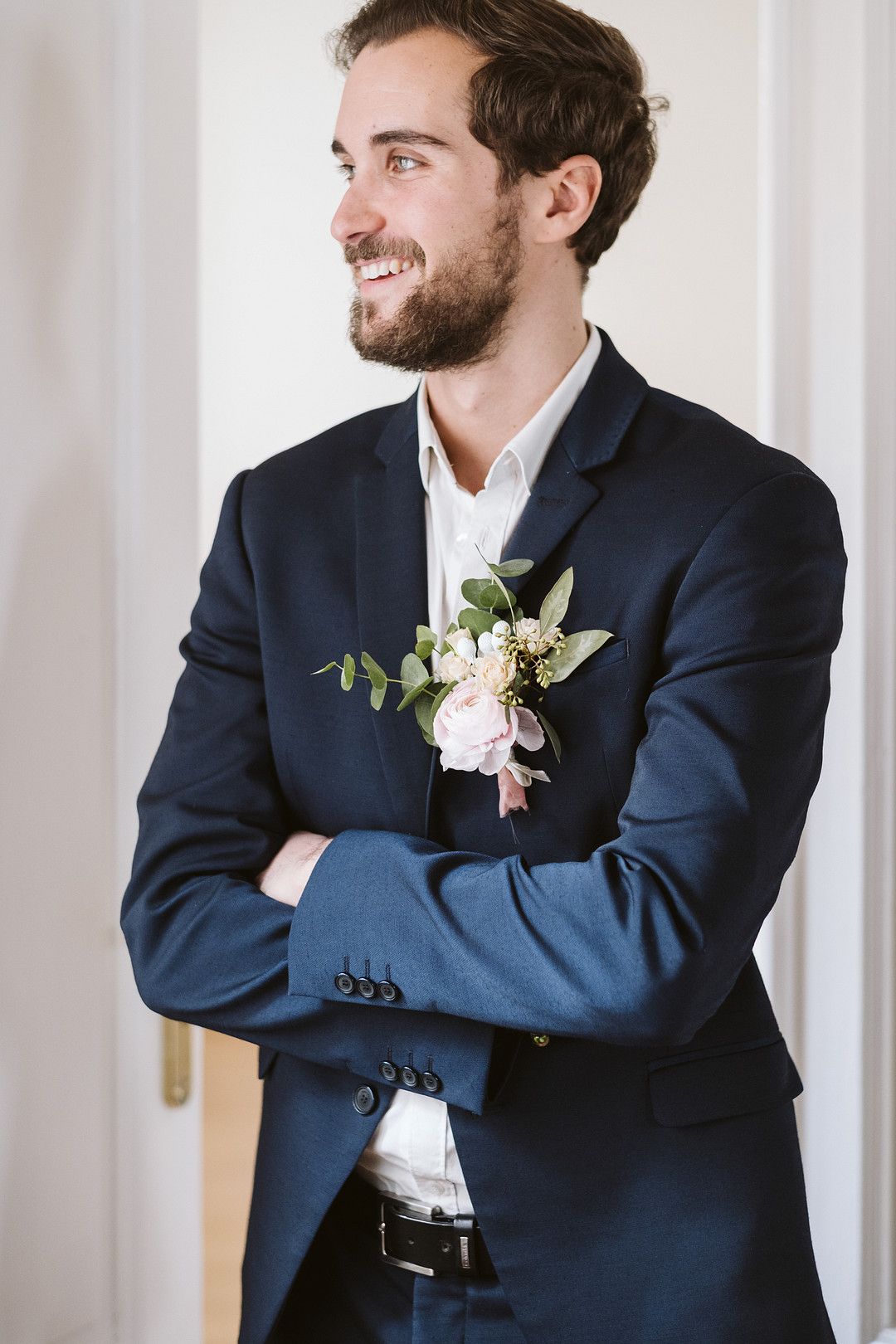 groom in suit at at home elopement