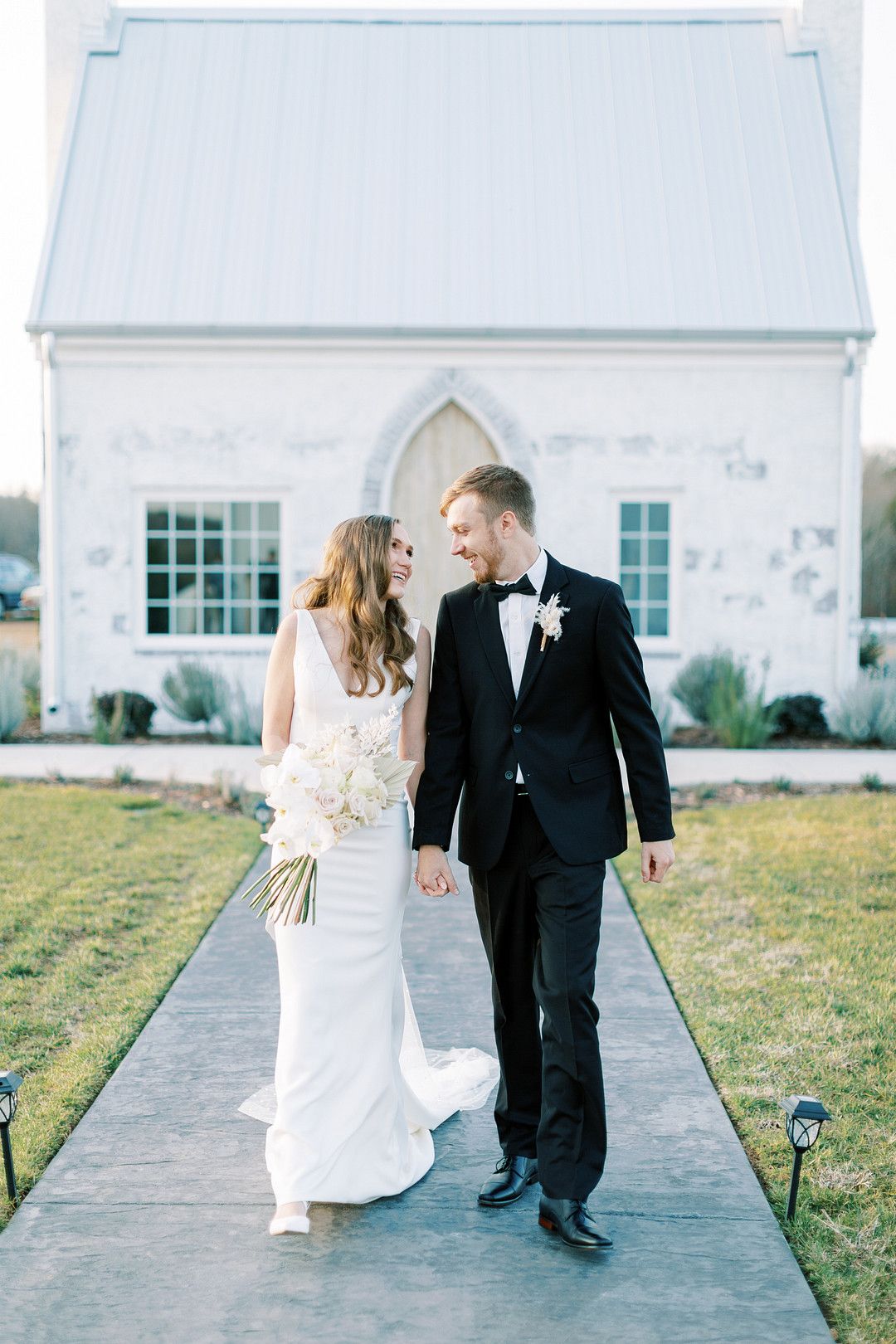 bride and groom at modern traditional chapel wedding