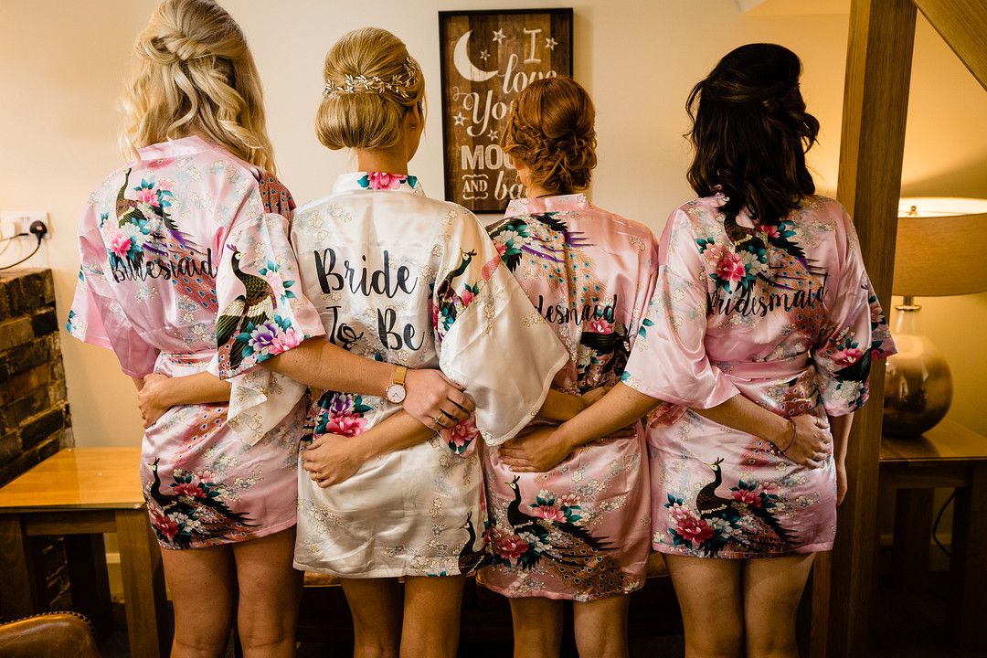 bridal party wearing floral getting-ready robes