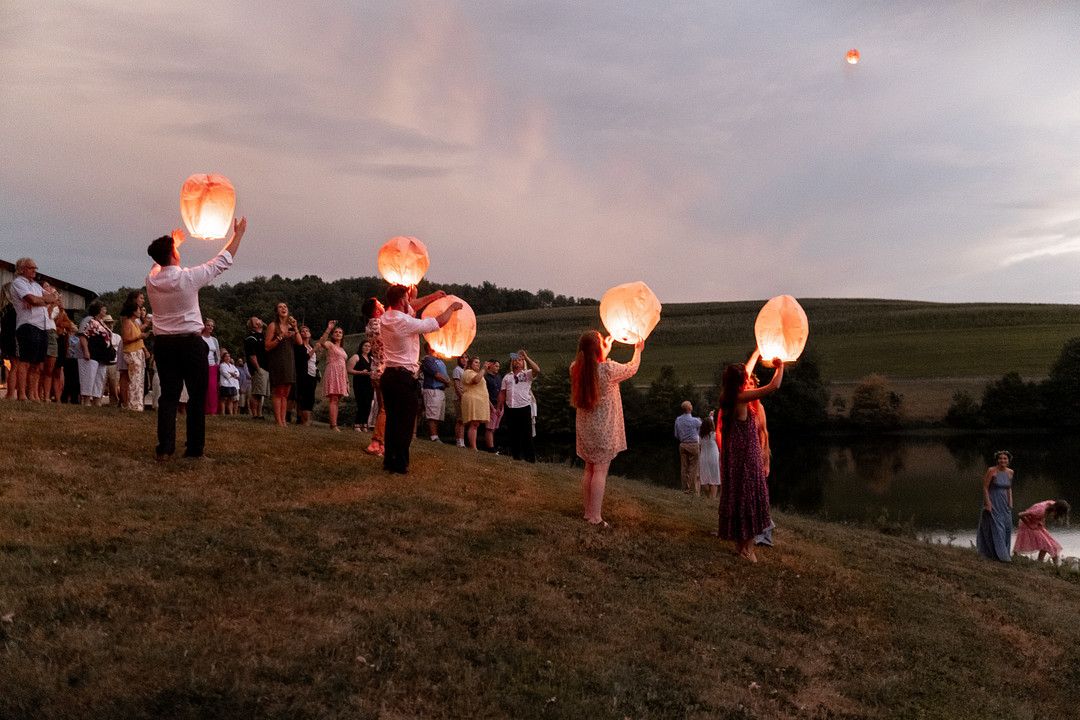 wedding guests releasing lanterns
