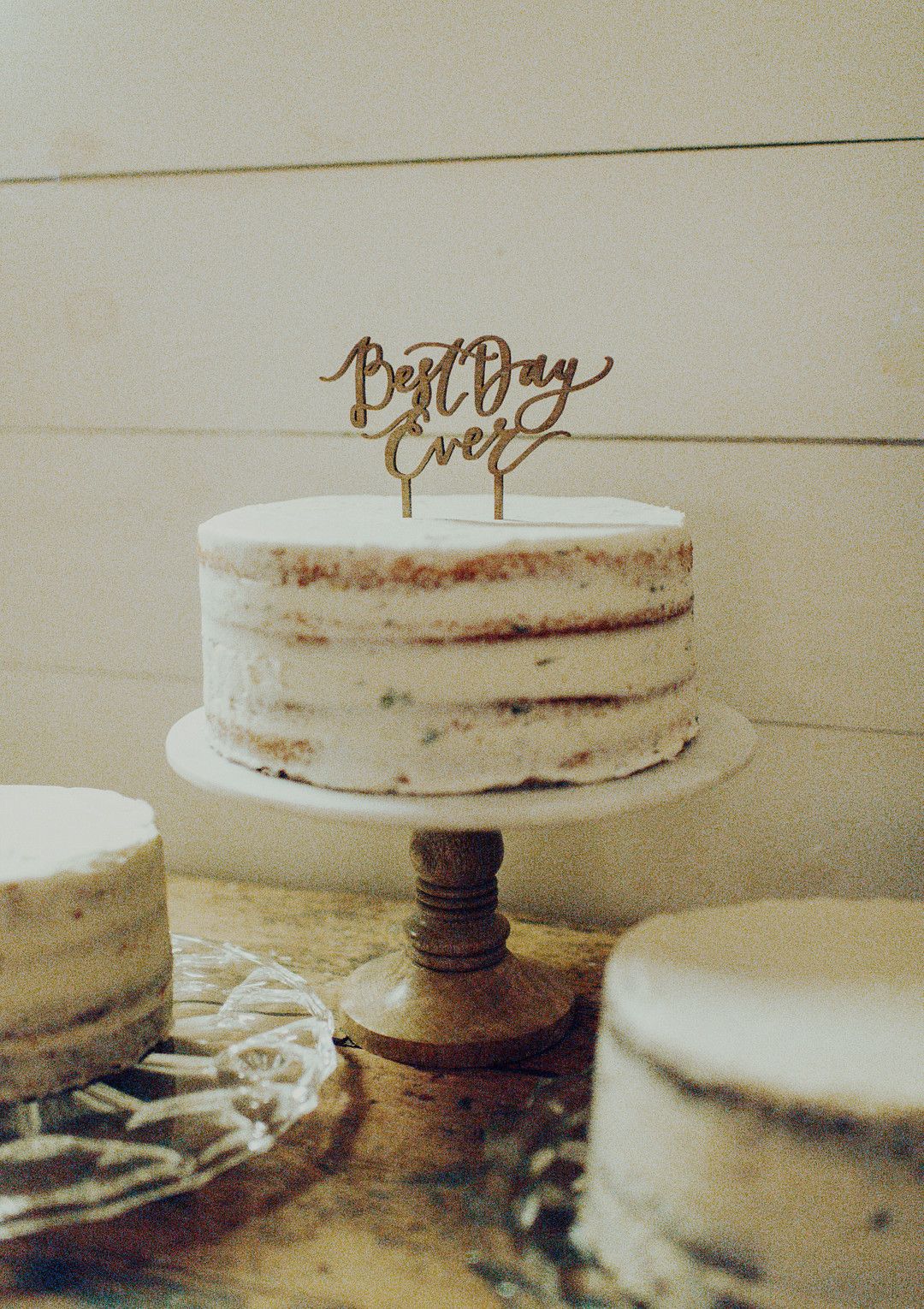 simple layer wedding cake with "best day ever" cake topper