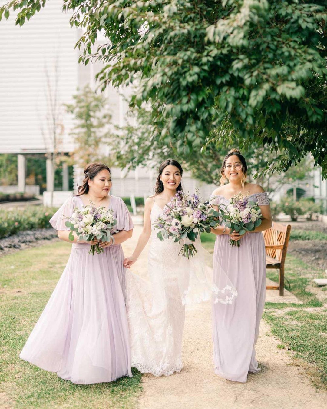 rustic bridesmaids wearing pastel purple dresses