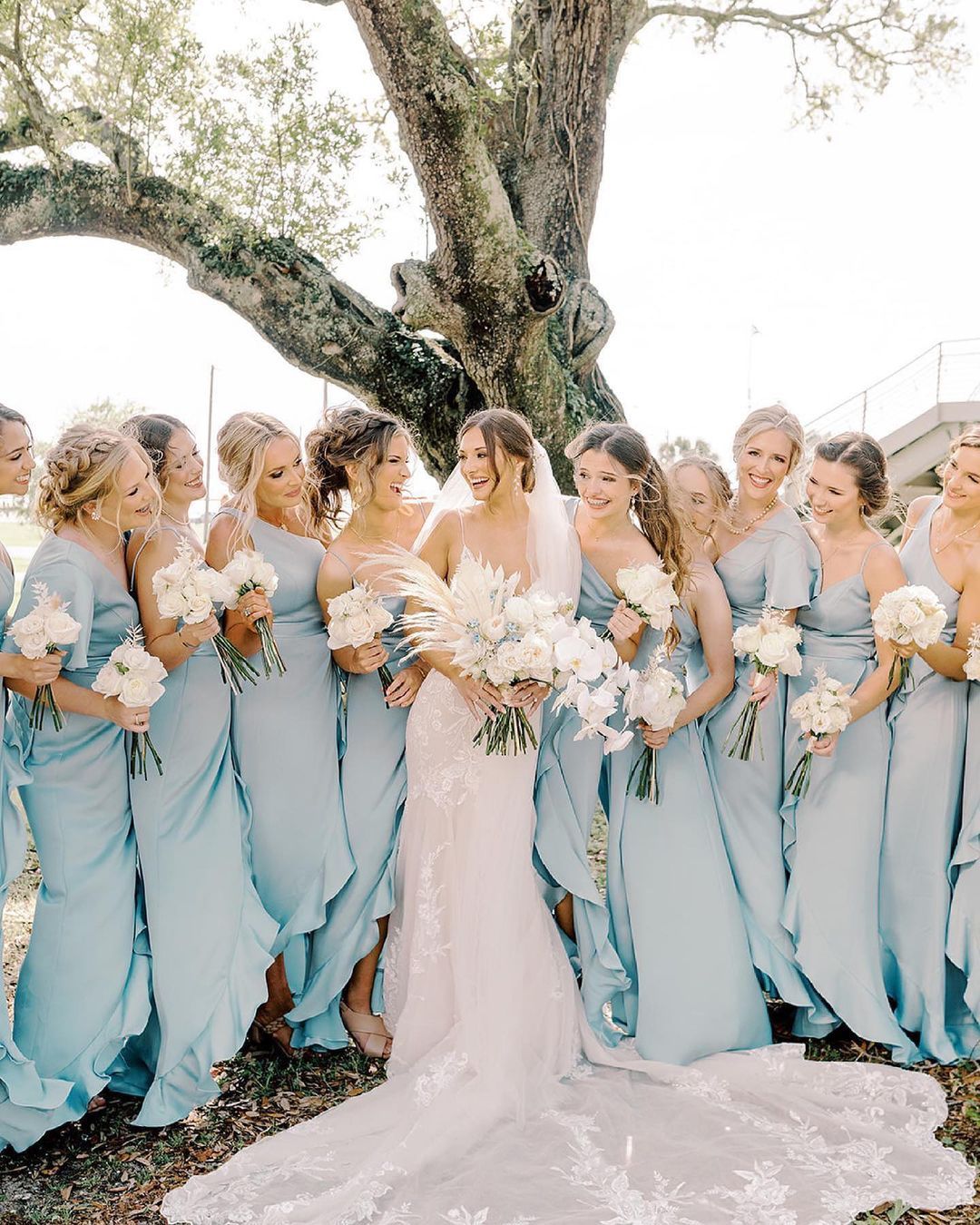 bridesmaids wearing dusty blue dresses