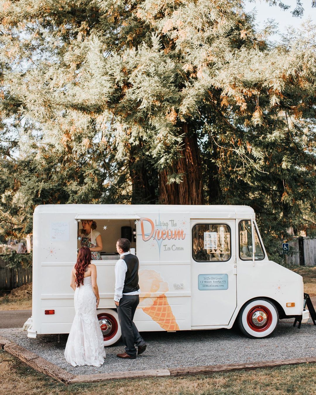 bride and groom getting ice cream at their wedding